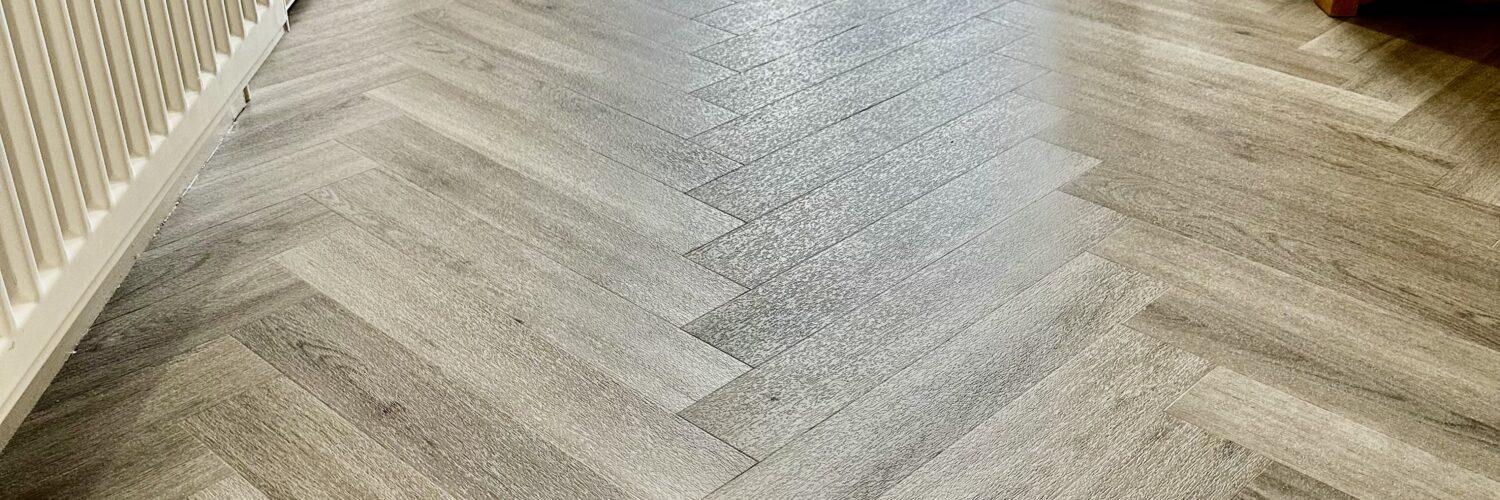 Wide plank Herringbone LVT fitted to Hallway